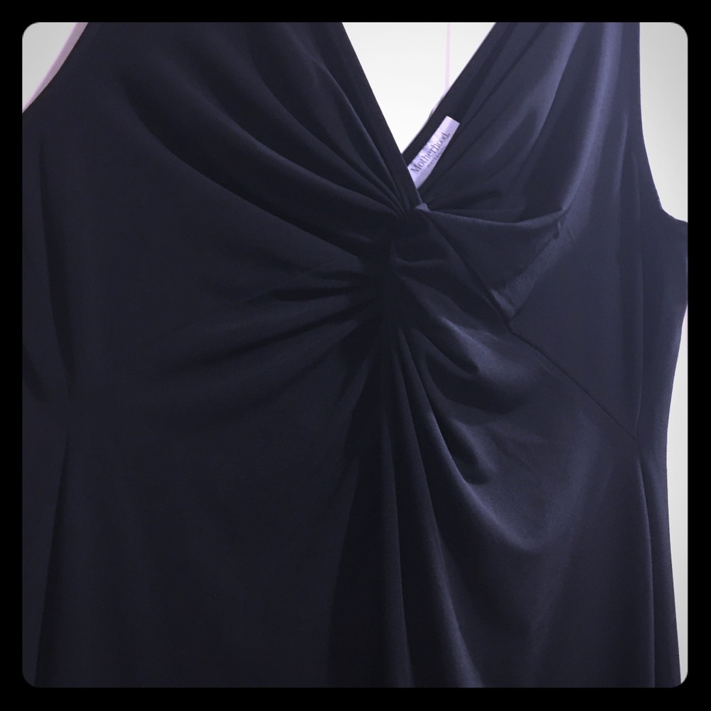 Black dress. Knee level